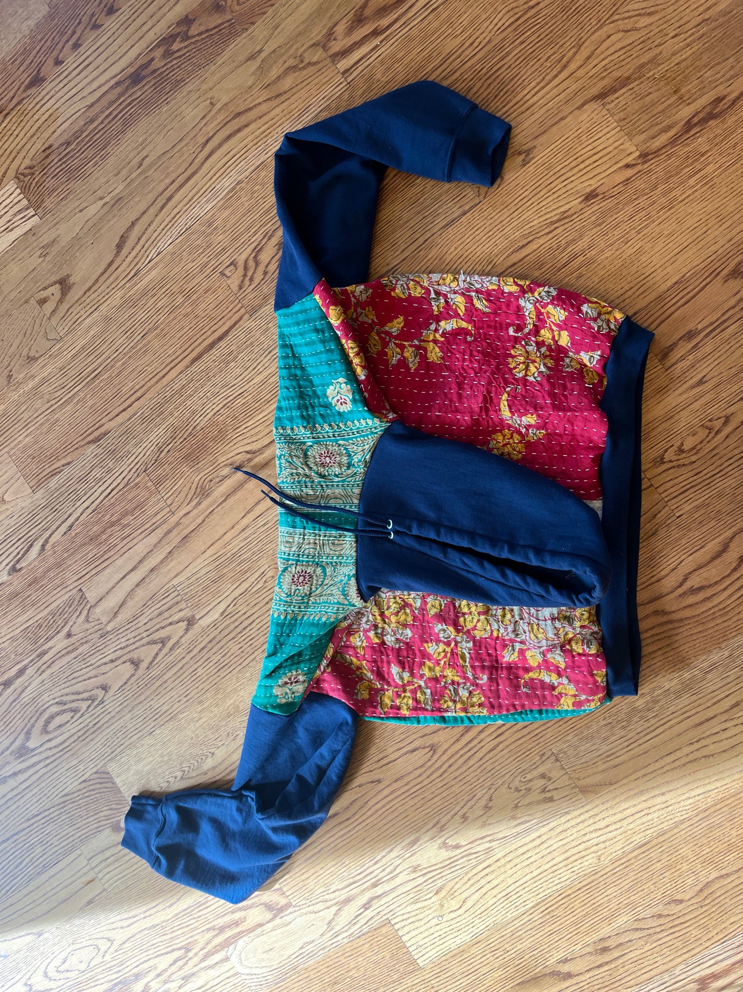 A. Upcycled men’s large hoodie